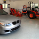 My dream garage. Tractor and M5. Show me a picture of a similar garage.